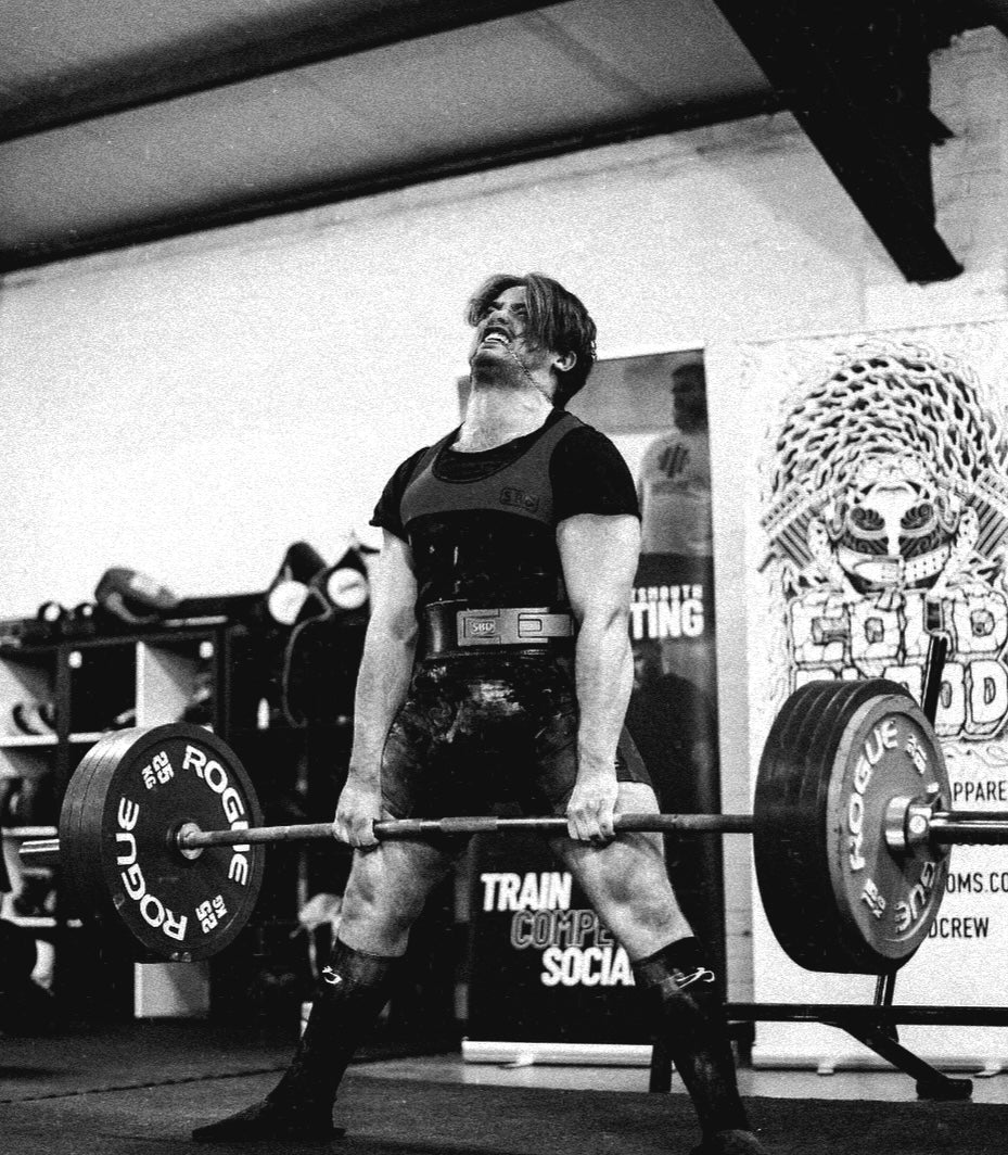 picture of a guy lifting weights